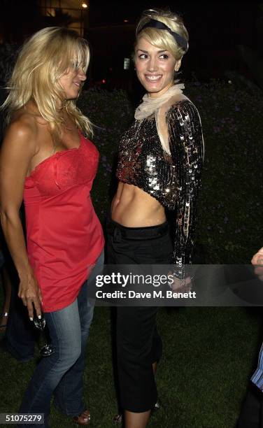 Actress Pamela Anderson with No Doubt singer Gwen Stefani inside the Prada Beverly Hills store opening night party on July 15, 2004 in Beverly Hills,...