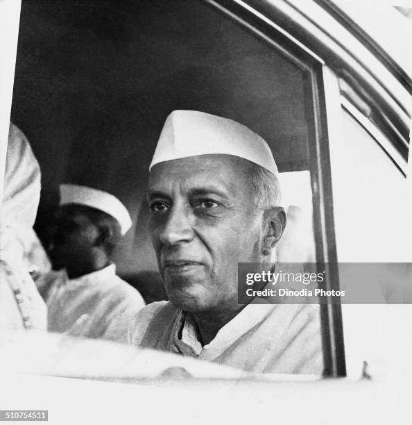 Pandit Jawaharlal Nehru in cap , Uttar Pradesh , India , 1953 .