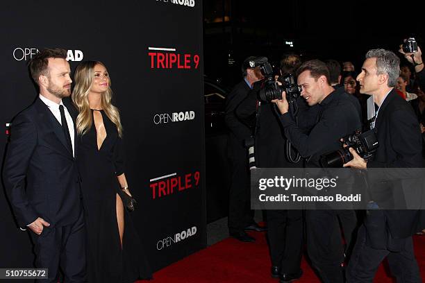 Actor Aaron Paul and Lauren Parsekian attend the premiere of Open Road's "Triple 9" held at Regal Cinemas L.A. Live on February 16, 2016 in Los...