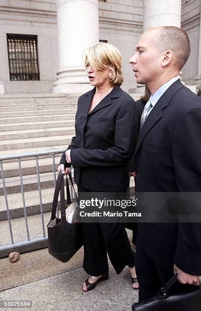 Martha Stewart walks outside Federal Court after her sentencing hearing July 16, 2004 in New York City. Stewart was sentenced to five months in...