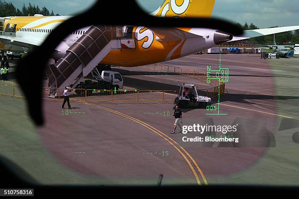 Boeing Co. 787 Dreamliner aircraft operated by Scoot Pte., a unit of Singapore Airlines Ltd. , is seen through the heads up display in the cockpit of...