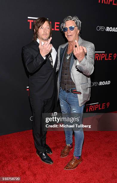 Actors Norman Reedus and Mickey Rourke attend the premiere of Open Road's new film "Triple 9" at Regal Cinemas L.A. Live on February 16, 2016 in Los...