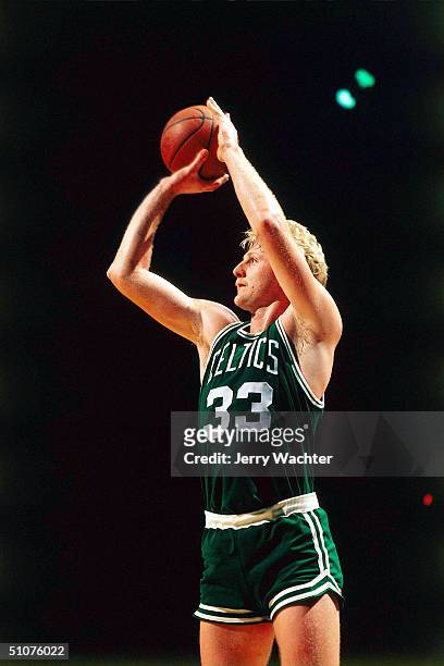 Larry Bird of the Boston Celtics takes a jump shot circa 1981 during an NBA game. NOTE TO USER: User expressly acknowledges and agrees that, by...