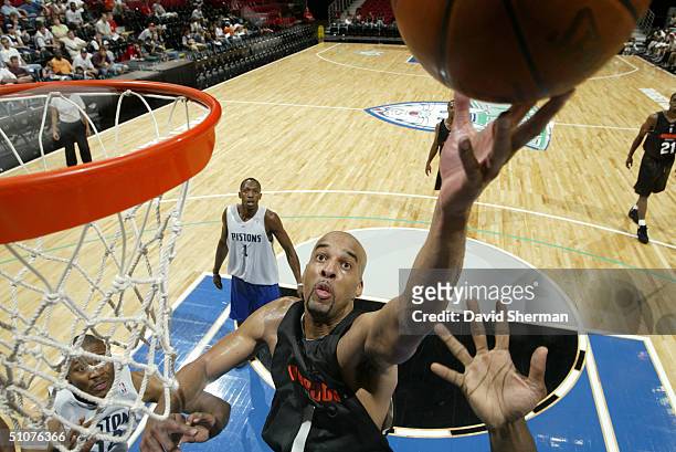 Loren Woods of the Charlotte Bobcats goes to the basket during the 2004 Minnesota Pro Summer League Game against the Detroit Pistons at the Target...
