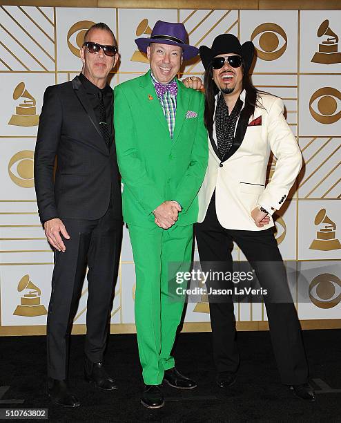 Musicians Paul Deakin, Jerry Dale McFadden and Eddie Perez of the Mavericks pose in the press room at the The 58th GRAMMY Awards at Staples Center on...