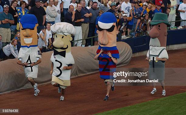 View of the Polish sausage, the Italian sausage, the Hot Dog, and the Bratwurst in the famous Sausage Race taken during the game between the...