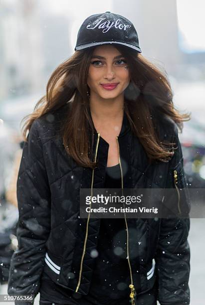 Victoria"u2019s Secret model Taylor Marie Hill wearing a black bomber jacket and a Taylor cap seen outside Jeremy Scott during New York Fashion Week:...