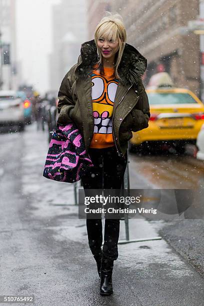 Model Soo Joo Park seen outside Jeremy Scott during New York Fashion Week: Women's Fall/Winter 2016 on February 15, 2016 in New York City.