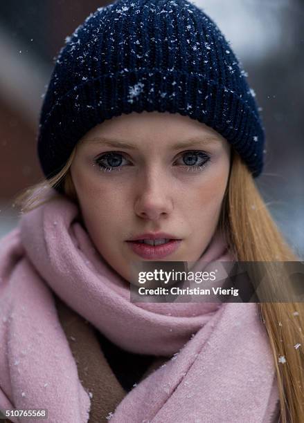 Portrait of Danish model Lululeika Liep wearing a pink scarf and a blue knit cap seen outside Phillip Lim during New York Fashion Week: Women's...