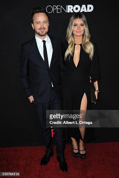 Actor Aaron Paul and wife Lauren Parsekian arrive for the premiere of Open Road's "Triple 9" held at Regal Cinemas L.A. Live on February 16, 2016 in...