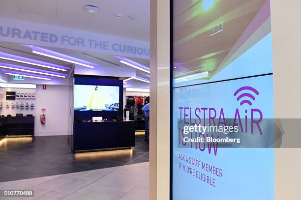 Sign advertising Telstra Corp.'s Telstra Air WiFi hotspot network is displayed inside a Telstra Discovery store in Melbourne, Australia, on Tuesday,...