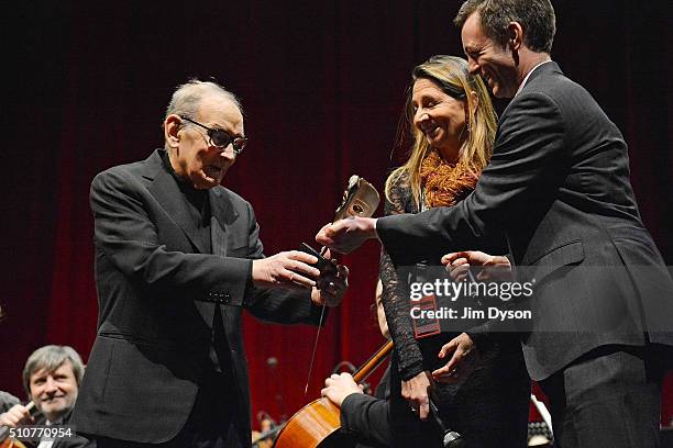 Italian composer Ennio Morricone receives his BAFTA award for best film score for 'The Hateful Eight' during the '60 Years of Music Tour' at the O2...