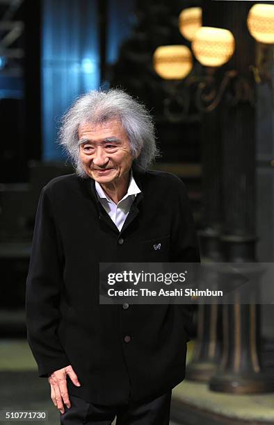 Conductor Seiji Ozawa leaves after a press conference after he won the Grammy Award for the best opera recording on February 17, 2016 in Kyoto,...