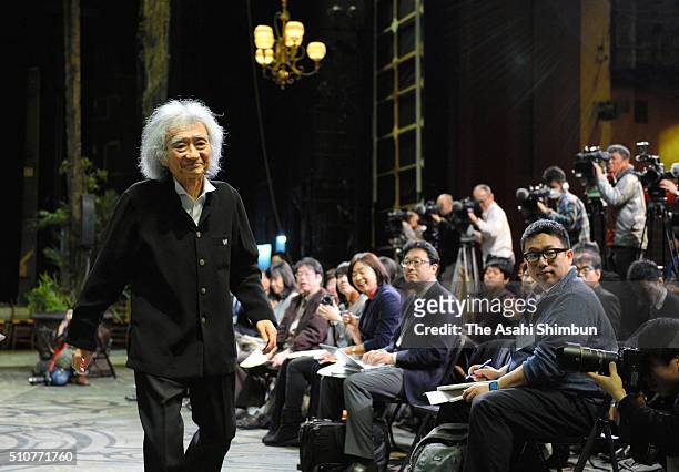Conductor Seiji Ozawa leaves after a press conference after he won the Grammy Award for the best opera recording on February 17, 2016 in Kyoto,...