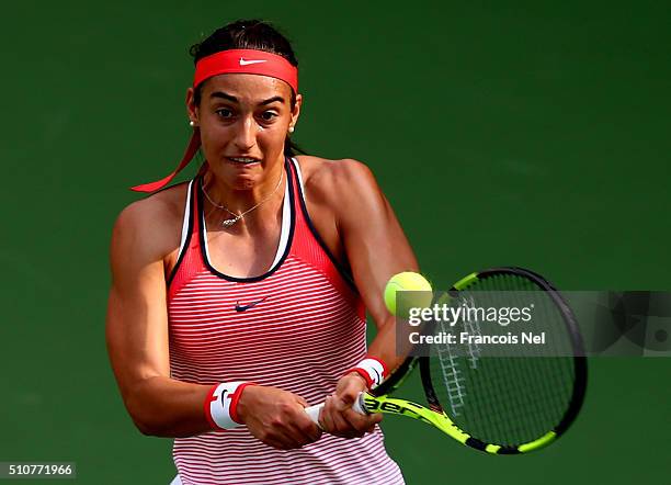 Carolina Garcia of France plays a backhand in her match against Carla Navarro of Spain during day three of the WTA Dubai Duty Free Tennis...