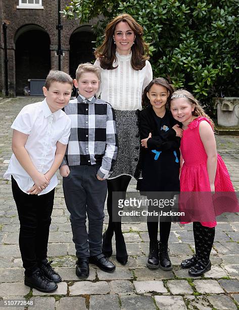 Catherine, Duchess of Cambridge poses with Solei Neil-Brown, Kiera Mullins, Haydan Pearce and Joshua Hogan, children from the 'Real Truth' video blog...
