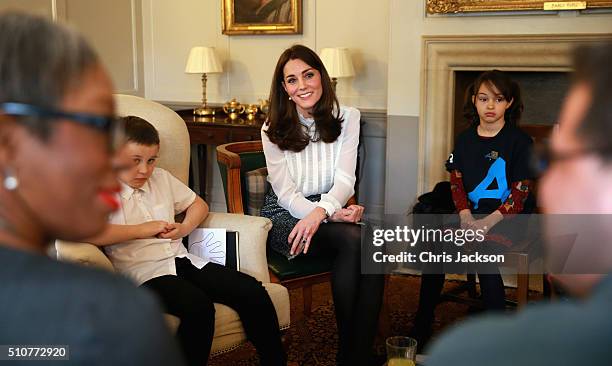 Catherine, Duchess of Cambridge talks to children from the 'Real Truth' video blog that features on the Huffington Post website at Kensington Palace...