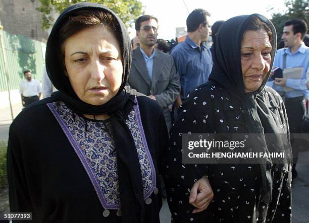 Shirin Ebadi , Nobel Peace prize winner and the lawyer for killed photograper Zahra Kazemi, accompanies Kazemi's mother, Ezzat Kazemi as they arrive...