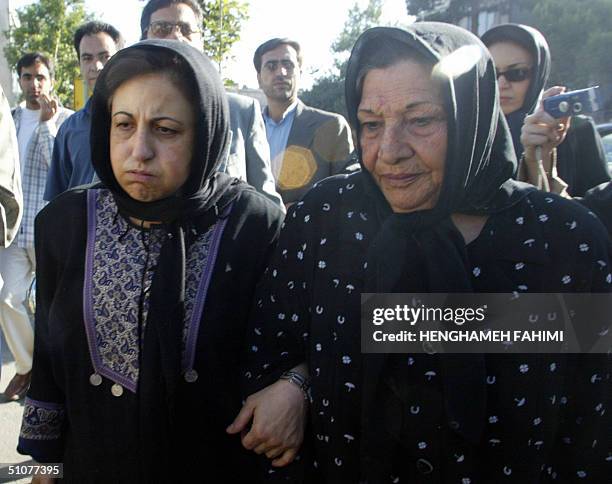Shirin Ebadi , Nobel Peace prize winner and the lawyer for killed photograper Zahra Kazemi, accompanies Kazemi's mother, Ezzat Kazemi as they arrive...