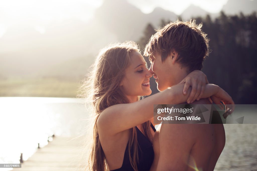 Young couple about to kiss in a natural environmen