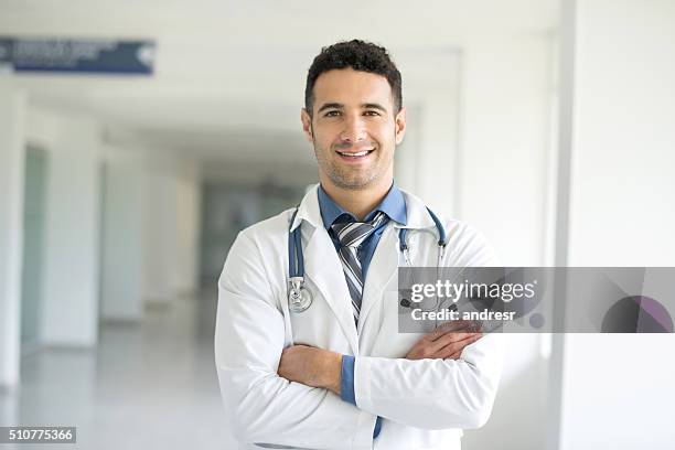 young doctor at the hospital - handsome doctors stock pictures, royalty-free photos & images