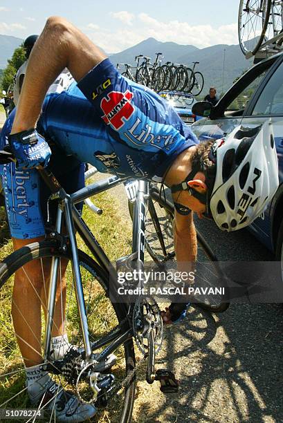 France: Spaniard Roberto Heras cheks his bike after a fall during the 13th stage of the 91st Tour de France cycling race between Lannemezan and...
