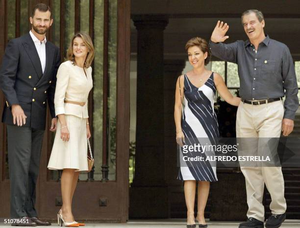 Prince Felipe de Borbon , Mexican President Vicente Fox and their wives Letizia Ortiz and Martha Sahagun wave to the press 17 July 2004, at Los Pinos...