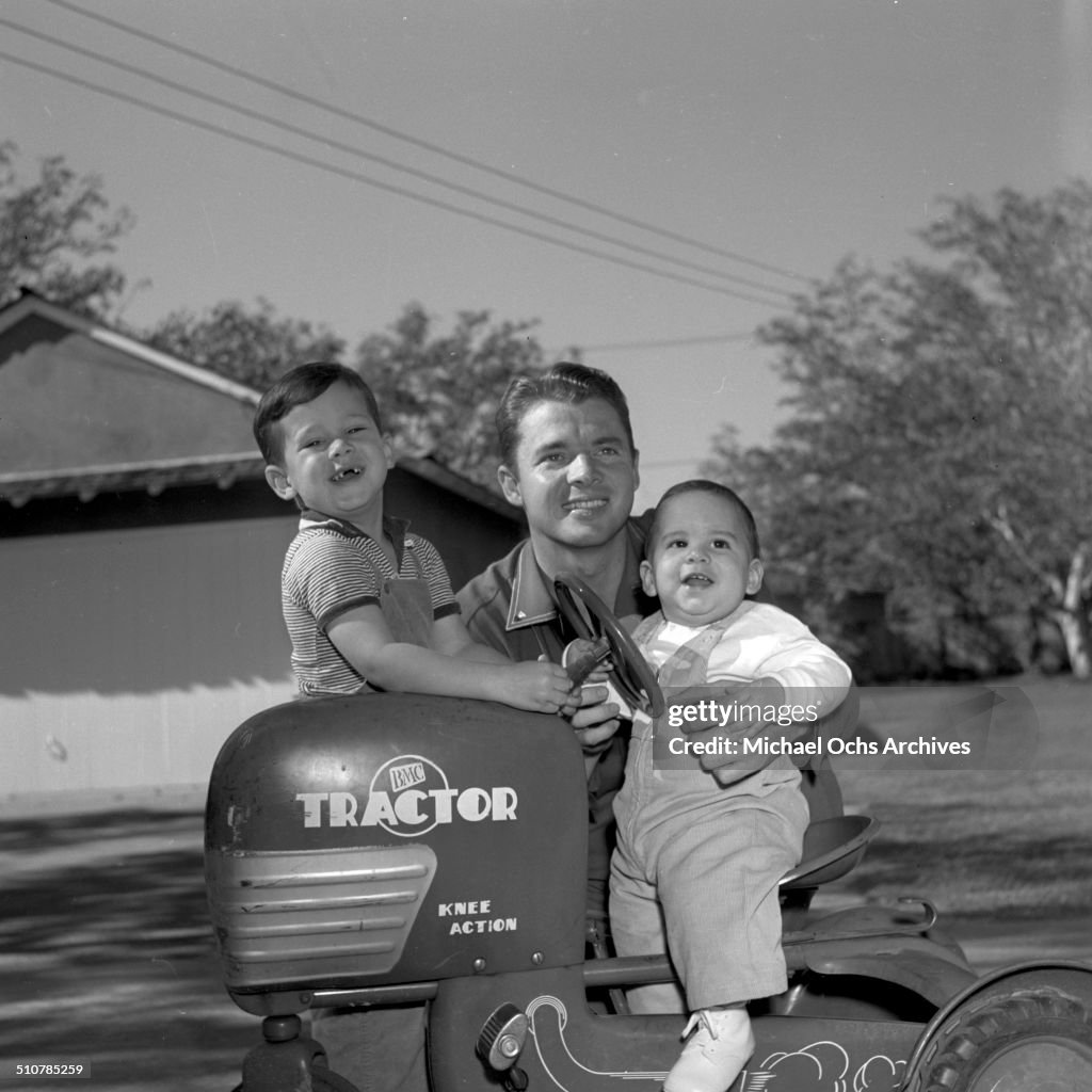 Audie Murphy poses with sons Terry and James in Perris,CA. News Photo