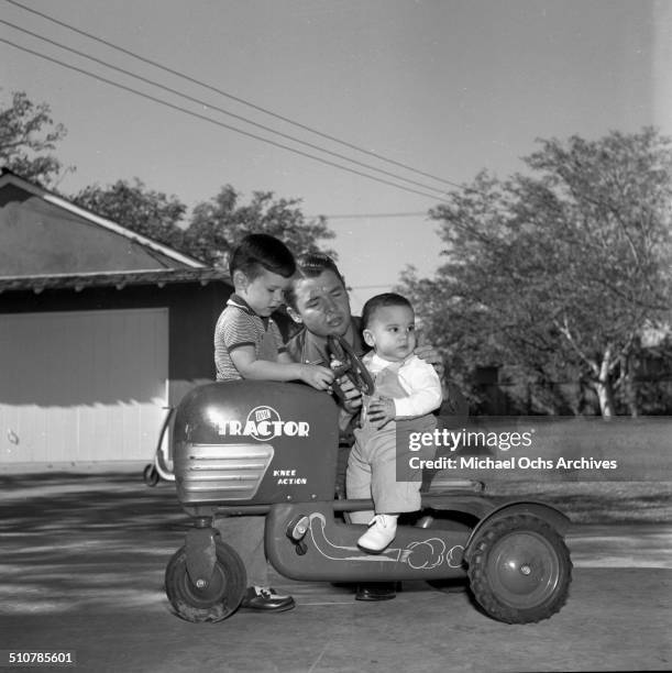 Audie Murphy poses with sons Terry and James in Perris,CA.