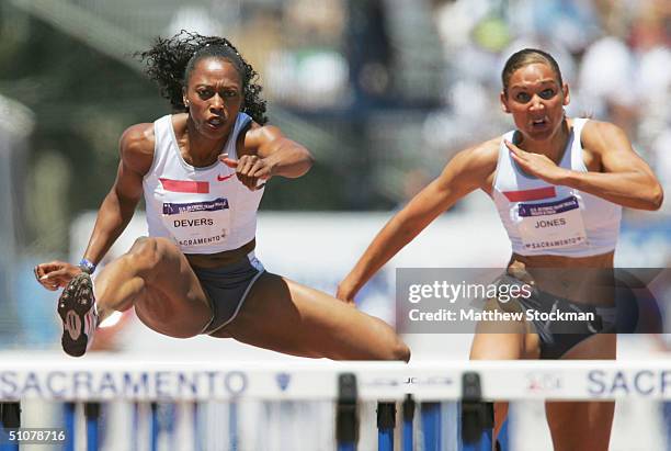 Gail Devers and Miesha McKelvy-Jones competes in the women's 100 meter hurdles quarterfinals during the U.S. Olympic Team Track & Field Trials on...