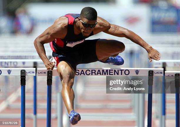 Terrence Trammell competes in the men's 200 Meter Hurdles Quarterfinals during the U.S. Olympic Team Track & Field Trials on July 17, 2004 at the...