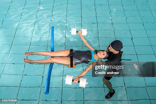 injured woman doing hydrotherapy - aquatic therapy stock pictures, royalty-free photos & images