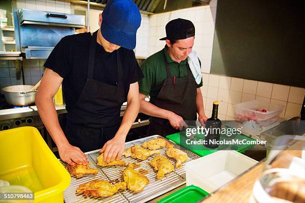 two restaurant chefs preparing chicken - bird chefs hat stock pictures, royalty-free photos & images