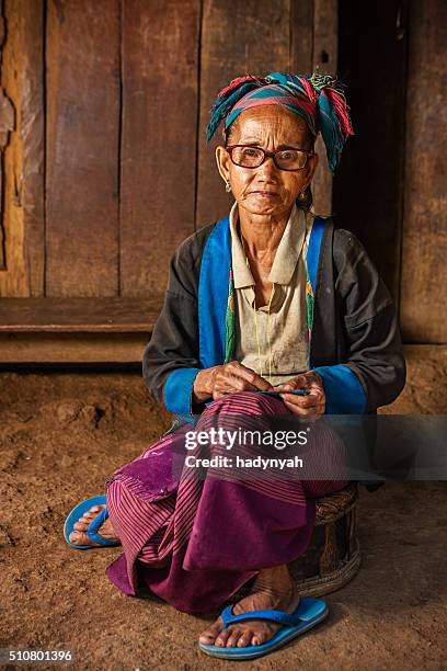 woman from the hill tribe sewing a pillow - akha woman stock pictures, royalty-free photos & images
