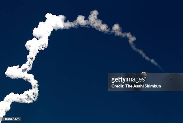 Japan Aerospace Exploration Agency H-IIA 30 leaves a contrail after the launch from the JAXA's Tanegashima Space Center on February 17, 2016 in...