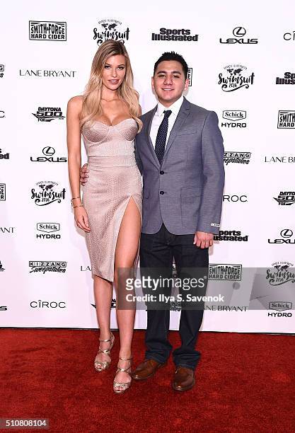 SchickMagnet contest winner Jorge Anaya poses on a red carpet with model Samantha Hoopes as she teams up with Schick Hydro to celebrate the launch of...