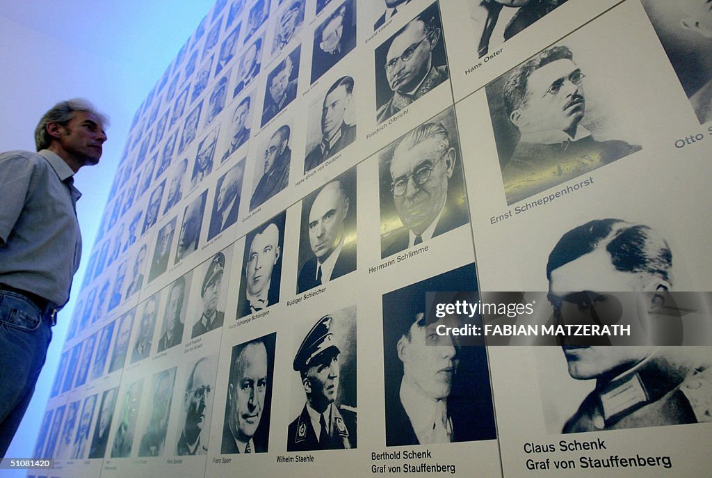 A visitor looks at a board displaying po
