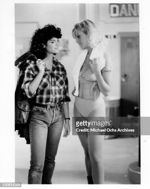Betsy Russell gets advice on acting and dressing feminine from Kristi Somers in a scene from the movie "Tomboy" circa 1985.