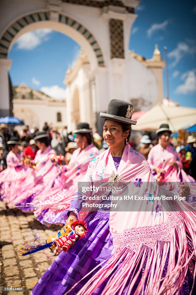 Dancers in pink costume, Fiesta de la Virgen de la Candelaria, Copacabana, Lake Titicaca, Bolivia, South America