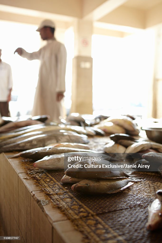 Stall holders in local fish market, Muttrah, Muscat, Oman, Middle East