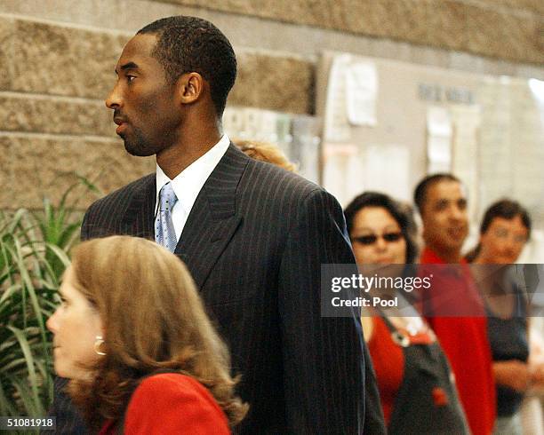 Los Angeles Lakers star Kobe Bryant arrives with his attorney Pamela Mackey at the Eagle County Courthouse July 19, 2004 in Eagle, Colorado. Lawyers...