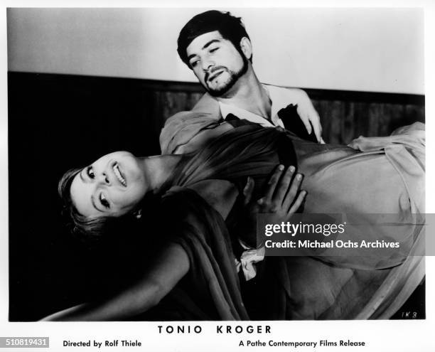Nadja Tiller falls into the arms of Jean-Claude Brialy as Tonio Kroeger in a scene from the movie "Tonio Kroeger" circa 1964.