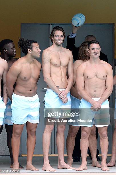 Teddy Thomas, Camille Lacourt and Dan Carter pose before the swimming training session at Piscine Molitor on February 17, 2016 in Paris, France.