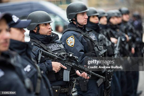 Members of the New York Police Department Strategic Response Group, which is funded in part through the Urban Area Security Initiative grant, stand...