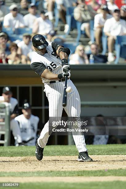 Frank Thomas of the Chicago White Sox swings at the pitch during the game against the Atlanta Braves at U.S. Cellular Field on June 13, 2004 in...