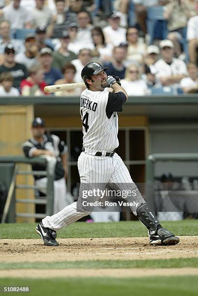 Paul Konerko of the Chicago White Sox swings at the pitch during the game against of the Atlanta Braves at U.S. Cellular Field on June 13, 2004 in...