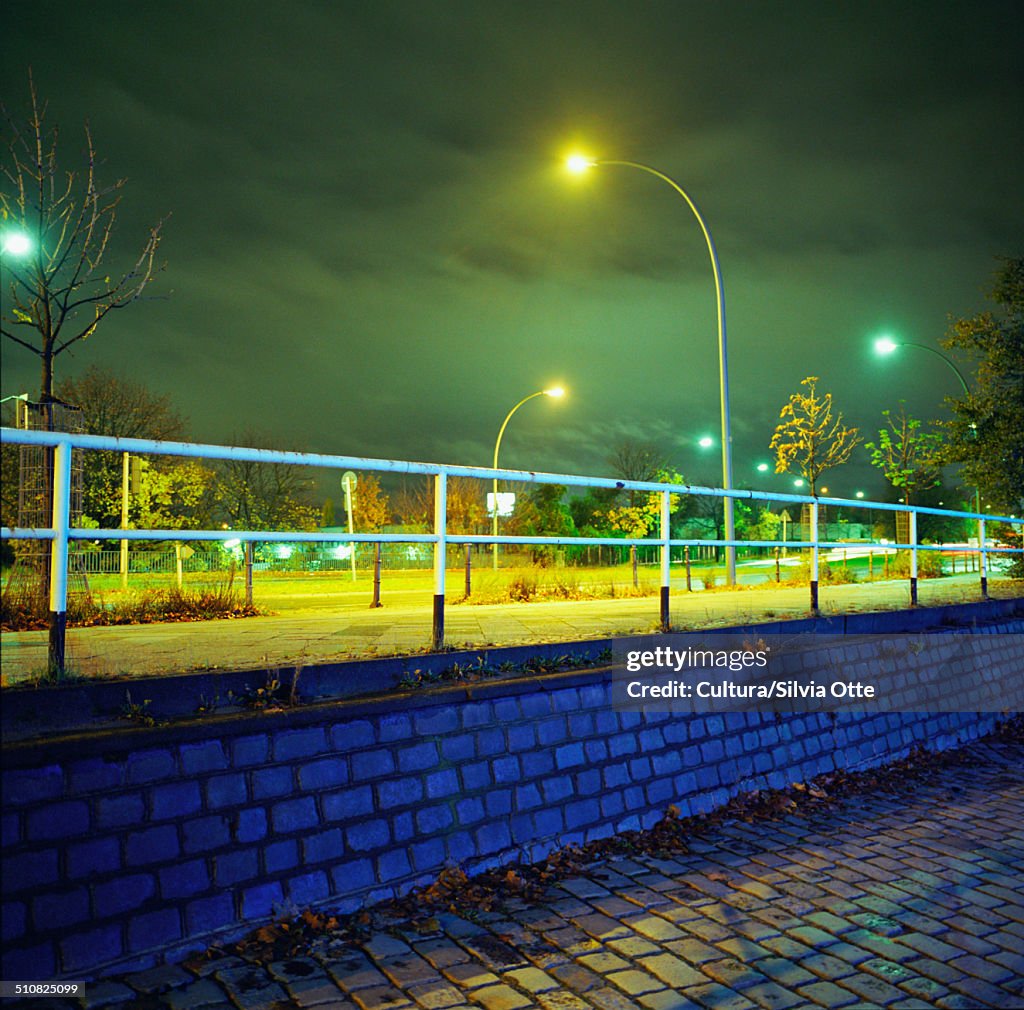 Lamp post and bridge at night