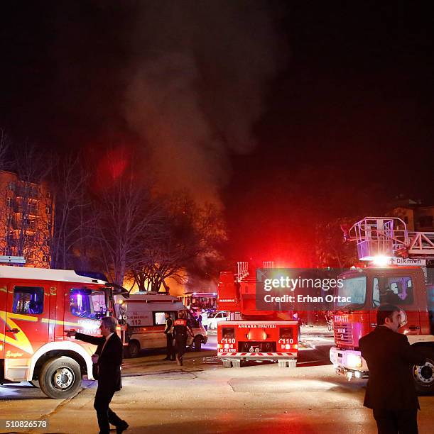 Smoke rises from the blast site as Turkish army busses burn after an explosion on February 17, 2016 in Ankara, Turkey. At least five people have been...