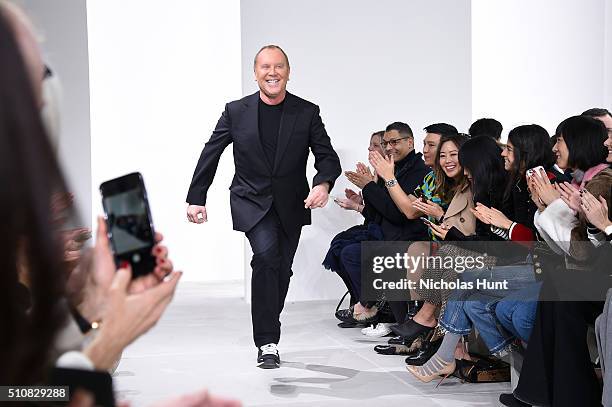 Designer, Michael Kors, walks the runway during the Michael Kors Fall 2016 During New York Fashion Week: The Shows at Spring Studios on February 17,...