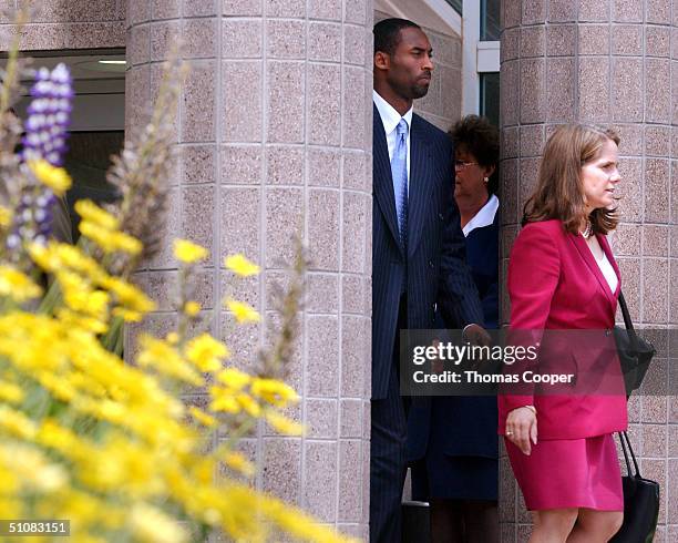 Los Angeles Lakers star Kobe Bryant and his attorney Pamela Mackey leave the Eagle County Justice Center after a day of pre-trial hearings July 19,...